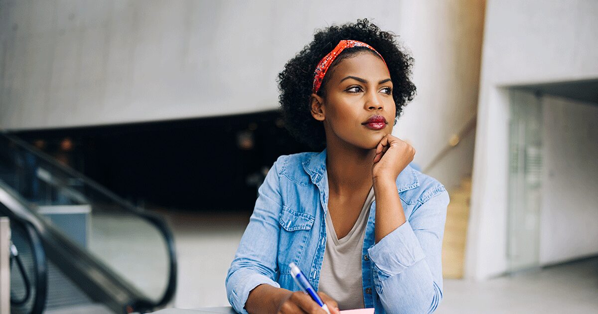 Woman thoughtfully considering her pregnancy decision after pressure from family and friends.